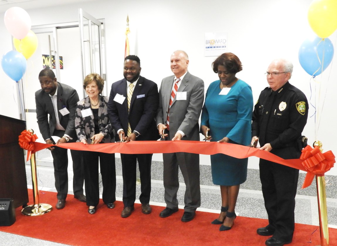 Ribbon cutting ceremony celebrates opening of KidSpace at Broward County Courthouse. From left to right: Broward County Assistant Administrator Alphonso Jefferson, Broward County Commissioner Nan Rich, Philip C. Harris, DBA, Administrator, Children’s Services Administration Section Community Partnership Division, Broward County Chief Judge Jack Tuter, Broward County Clerk of the Courts Brenda Forman, Broward Police Chiefs Assn. Domestic Violence Committee, Chief Paul O'Connell 